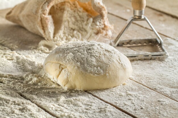 Close-up of wooden surface with dough