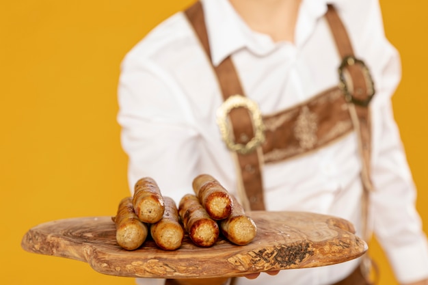 Free photo close-up of wooden tray with sausages