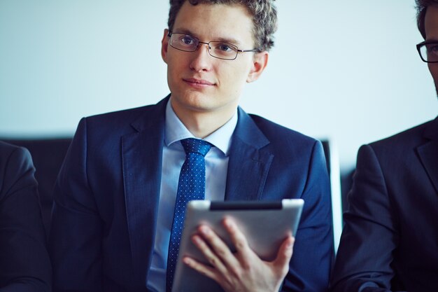 Close-up of worker in the conference