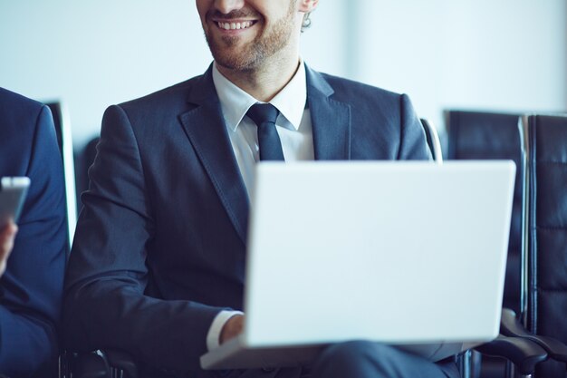 Close-up of worker with laptop