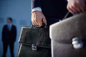 Free photo close-up of workers with briefcases