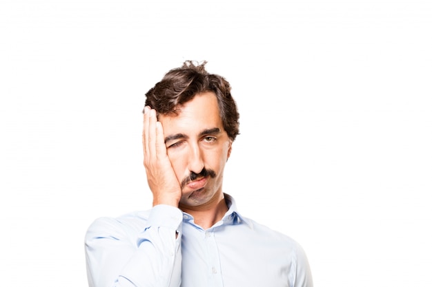 Close-up of worried man with hand on his face