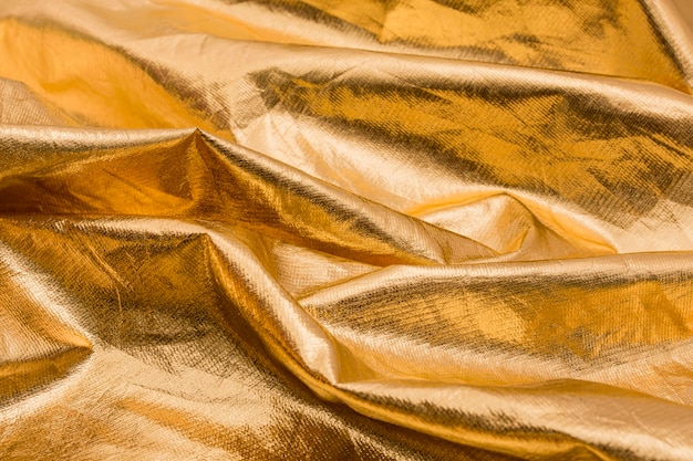 Free photo close-up wrinkled golden material