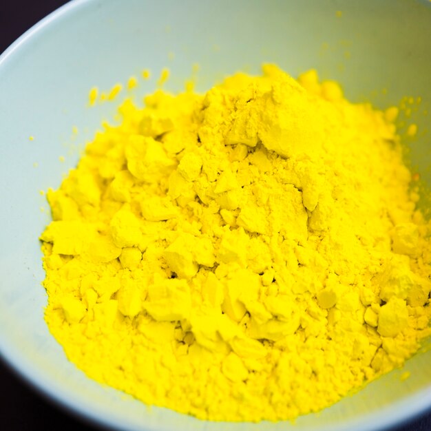 Close-up of yellow powder inside the bowl