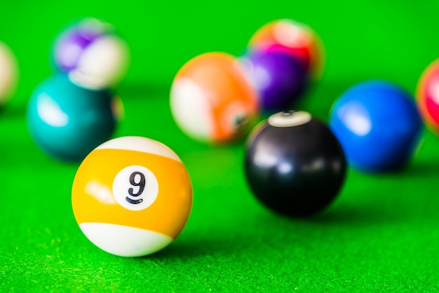 Close-up of yellow and white pool ball
