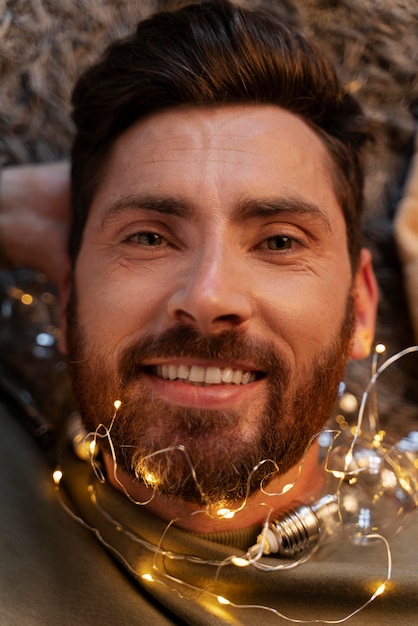 Close up on young adult enjoying christmas lights