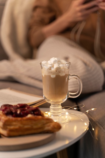 Close up on young adult enjoying warm drink