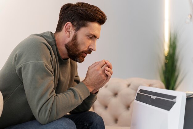 Close up on young adult getting warm by heating