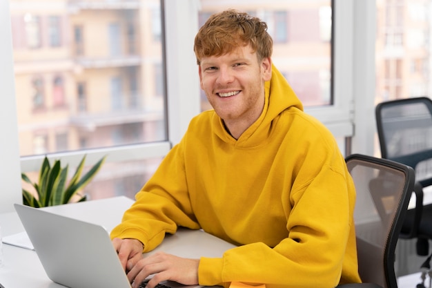 Close up on young adult working in office