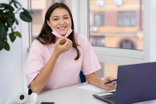 Close up on young adult working in office