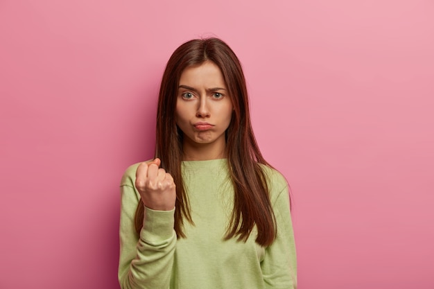 Close up on young attractive and charismatic woman isolated