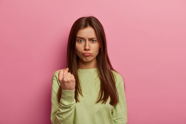 Close up on young attractive and charismatic woman isolated