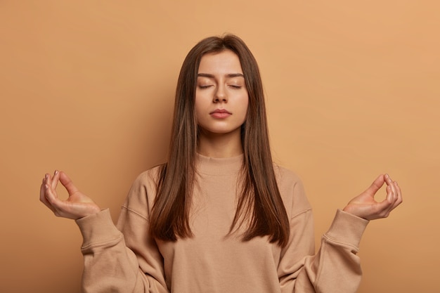 Close up on young attractive and charismatic woman isolated