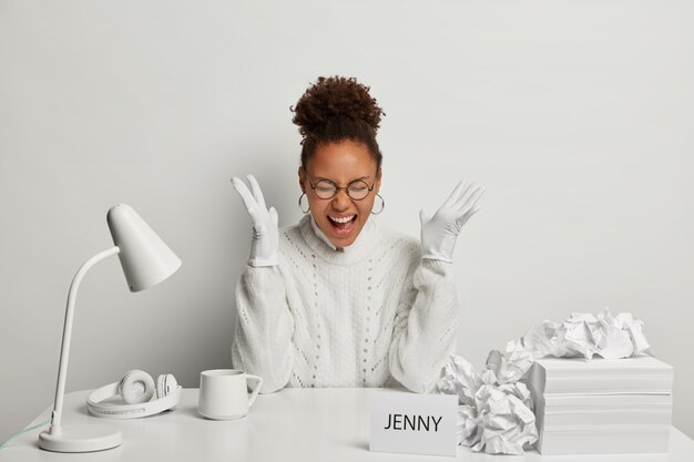 Close up on young beautiful woman at her desk