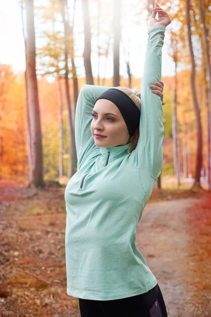 Close up on young beautiful woman jogging