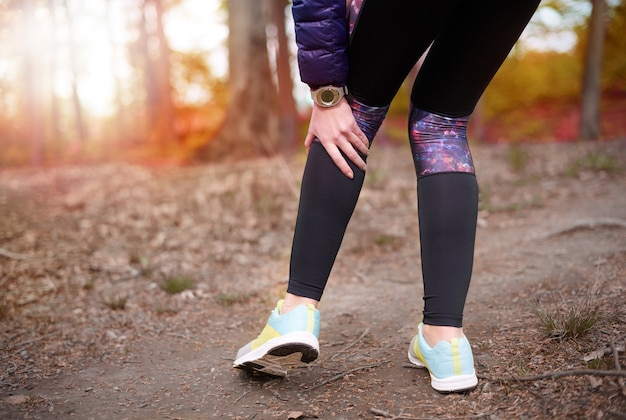 Free photo close up on young beautiful woman jogging