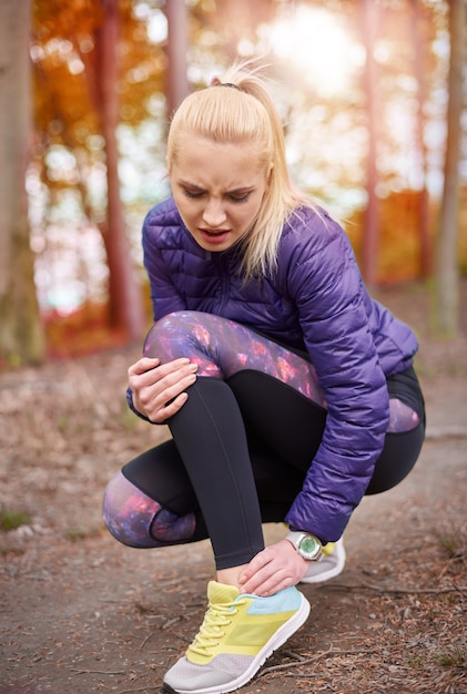 Close up on young beautiful woman jogging