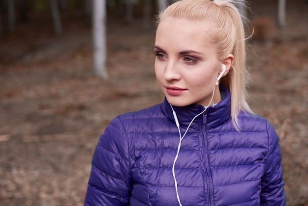 Close up on young beautiful woman jogging