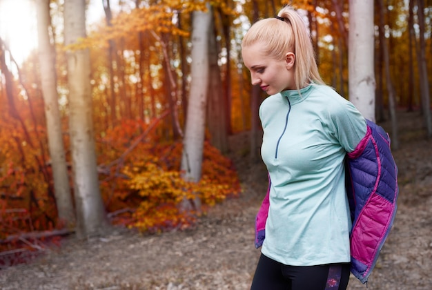 Close up on young beautiful woman jogging