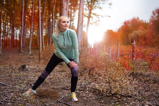 Close up on young beautiful woman jogging