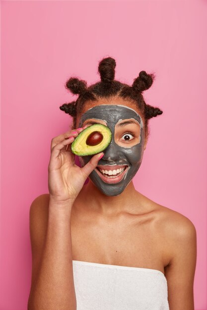 Close up on young beautiful woman with facial mask