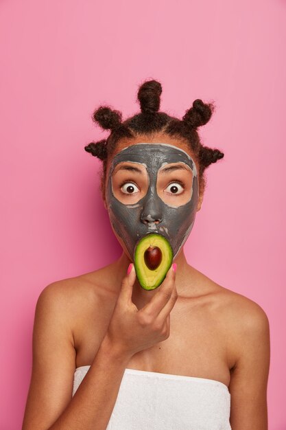 Close up on young beautiful woman with facial mask