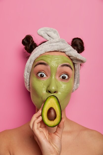 Close up on young beautiful woman with facial mask