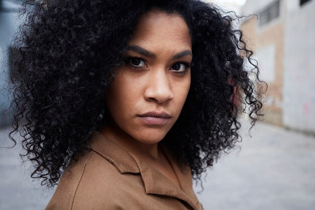 close up of young black woman with afro hair