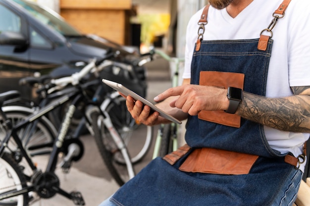 Close up on young businessman in bike shop