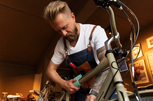 Close up on young businessman in bike shop