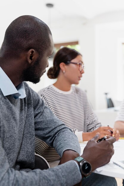 Close up on young colleagues having a meeting