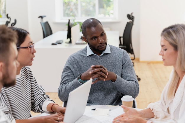 Close up on young colleagues having a meeting