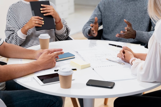 Close up on young colleagues having a meeting