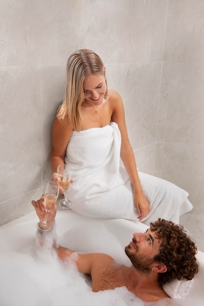 Free photo close up on young couple taking a bath