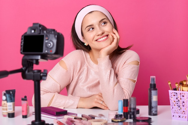 Close up young female blogger recording new video