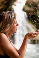 Free photo close up on young female hands in nature