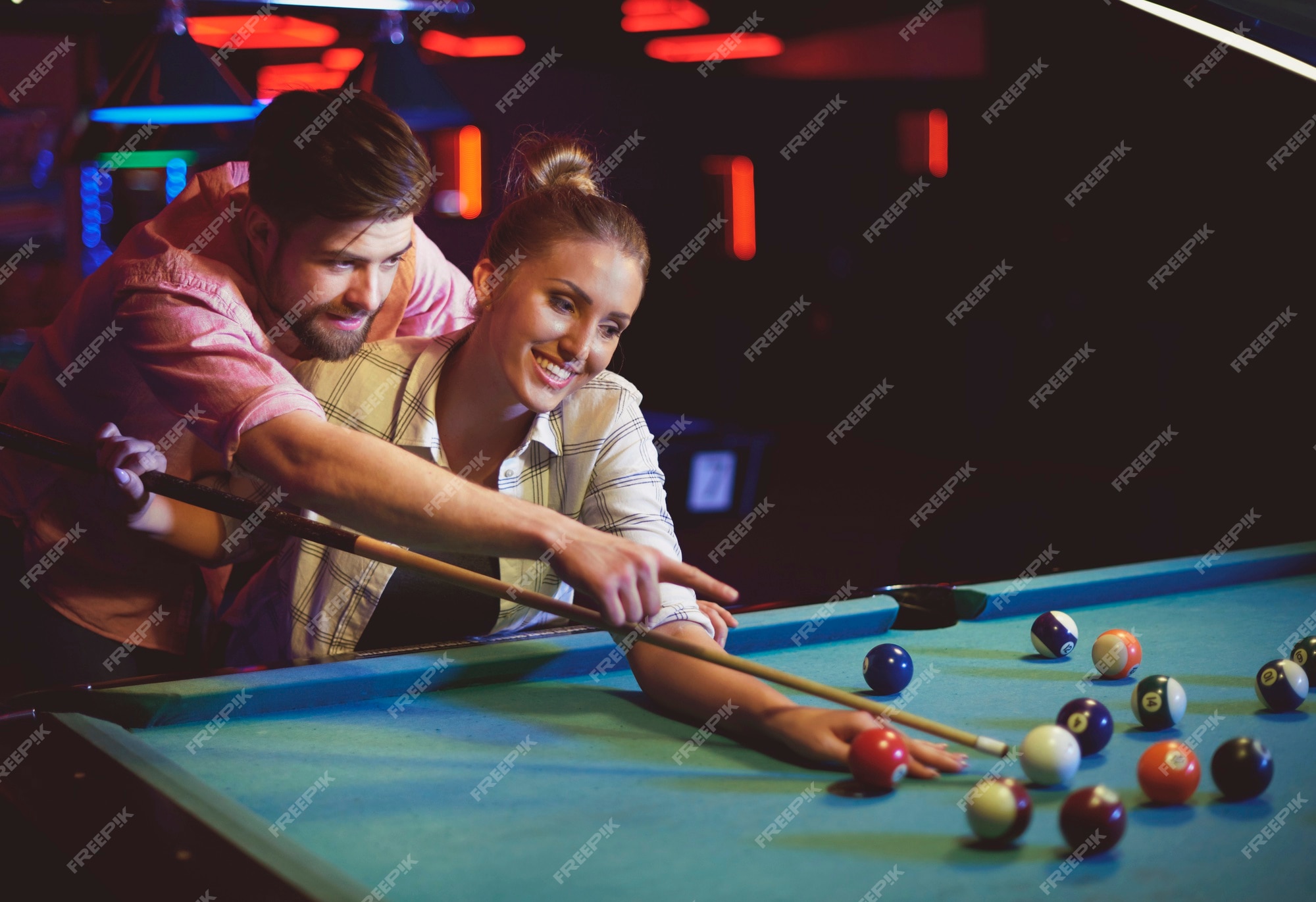 Billiards game. young friends playing pool together Stock Photo - Alamy