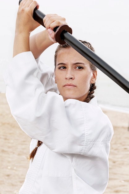 Free photo close-up young girl in karate costume