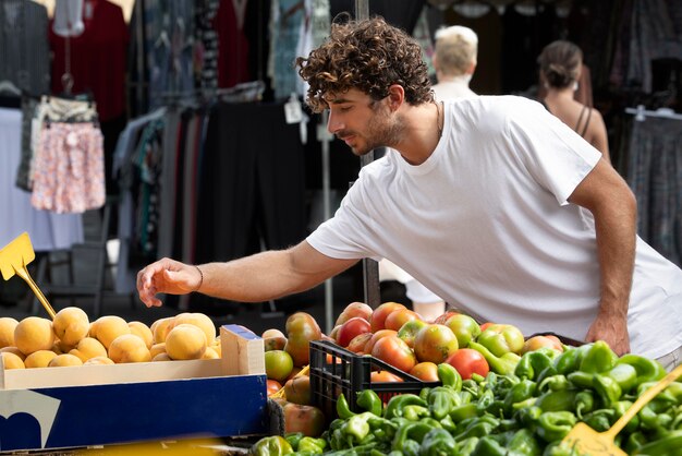 Close up on young man at the food market