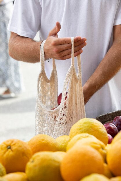 Close up on young man at the food market