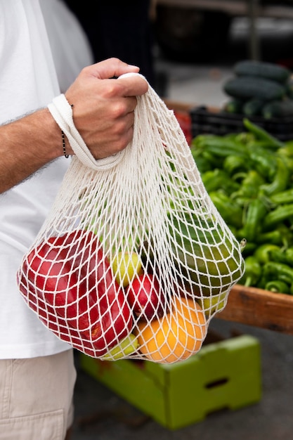 Close up on young man at the food market