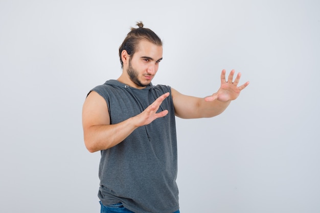 Close up on young man gesturing isolated