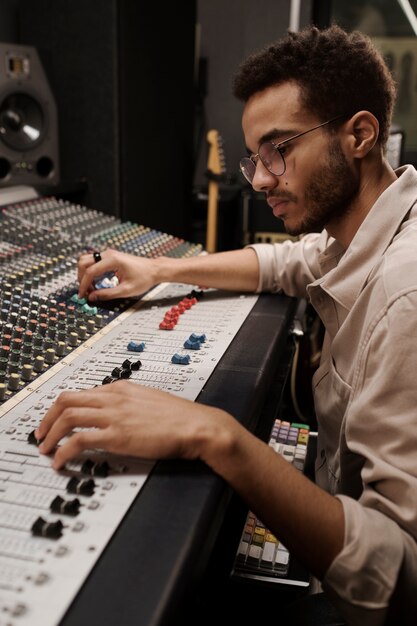 Close up young man making music