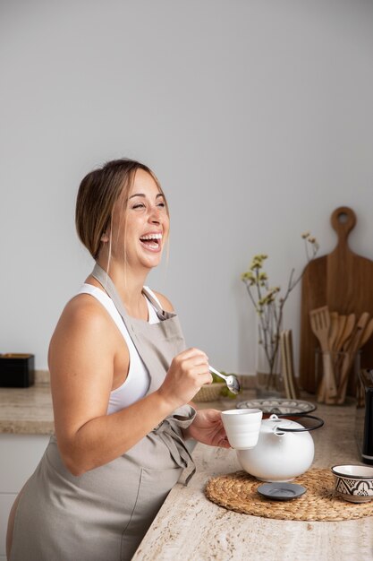 Close up on young pregnant woman cooking