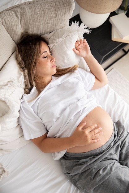 Close up on young pregnant woman sleeping