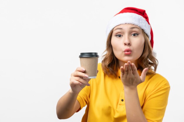 Close up on young pretty woman wearing Christmas hat isolated