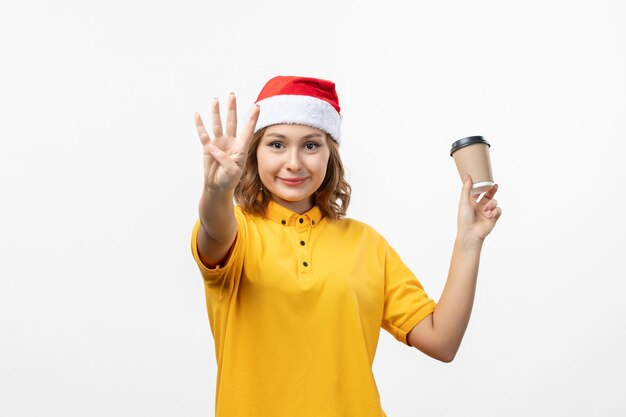 Close up on young pretty woman wearing Christmas hat isolated