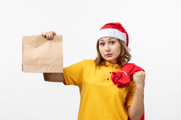 Close up on young pretty woman wearing Christmas hat isolated