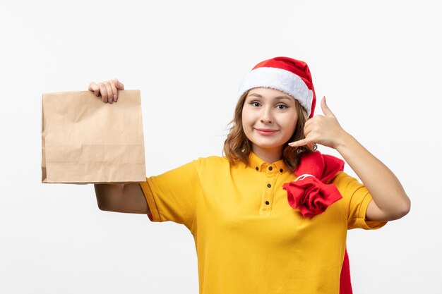 Close up on young pretty woman wearing Christmas hat isolated