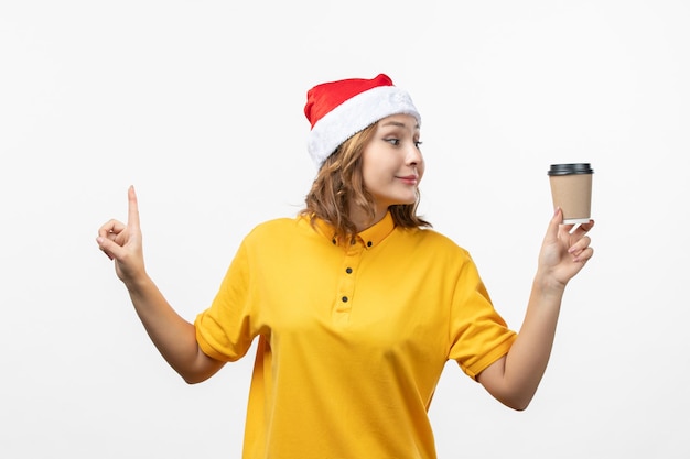 Close up on young pretty woman wearing Christmas hat isolated